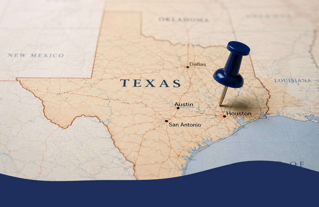 map of Texas with a push pin inserted into the middle of it